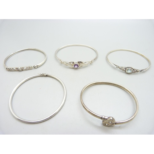 1002 - Five silver bangles, 42g