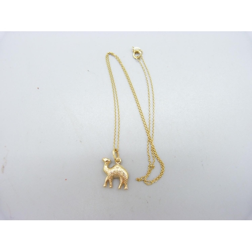 1005 - An 18ct gold camel charm on a fine 14ct gold chain, 2.7g