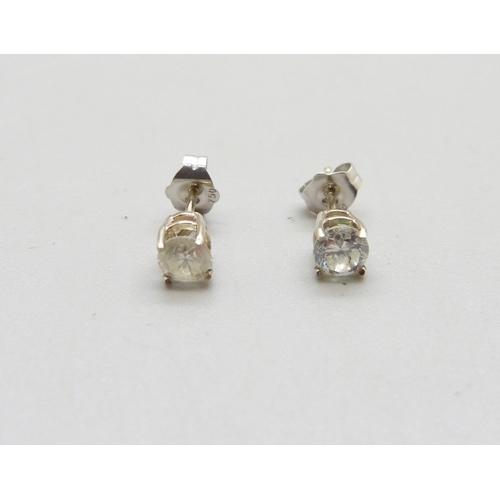 1008 - A pair of 18ct gold, diamond stud earrings, 0.60 total carat weight