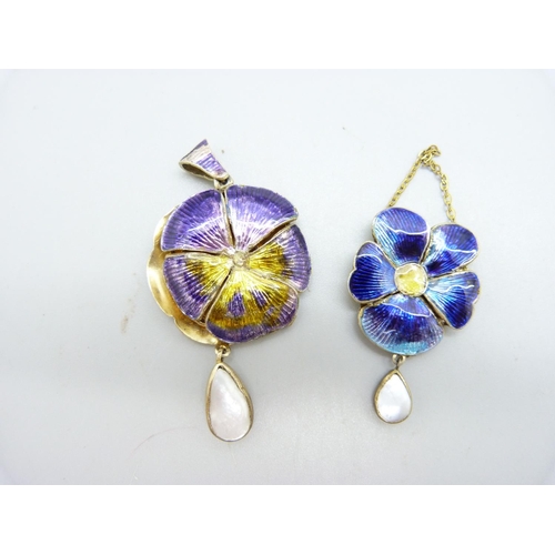 1010 - Two enamelled lockets with mother of pearl drops, (enamel of one a/f)