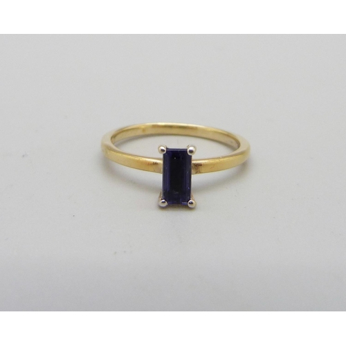 1029 - A silver gilt, emerald cut iolite solitaire ring, J