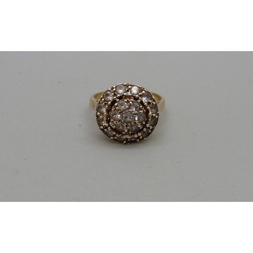 1031 - A 9ct gold, paste cluster ring, 4.2g, L