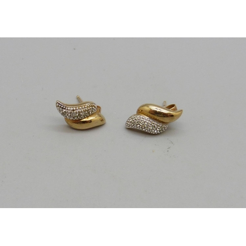 1069 - A pair of 9ct gold and diamond earrings, 2.3g