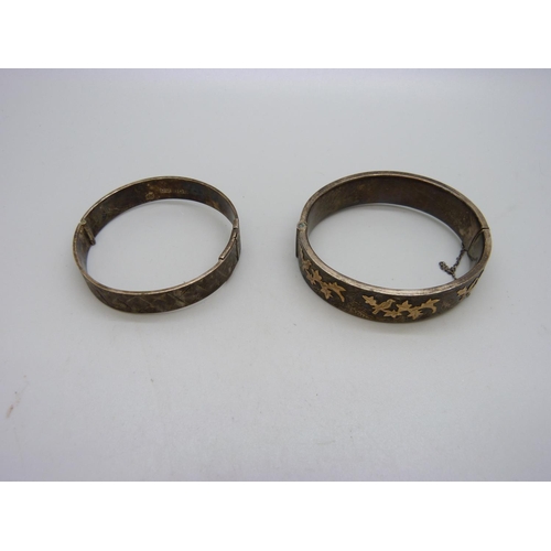 1071 - Two silver bangles, 54g