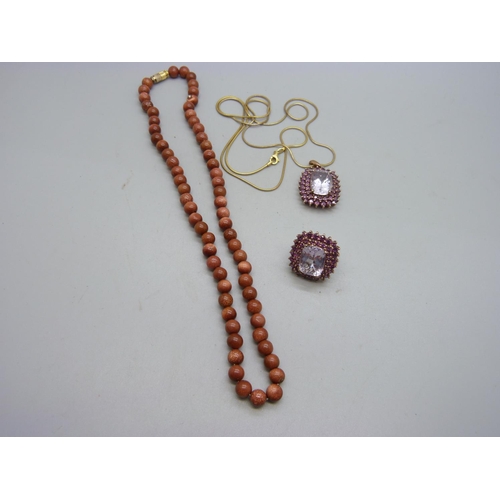 1090 - A gold stone bead necklace, a silver pendant on a silver chain and a silver ring, O