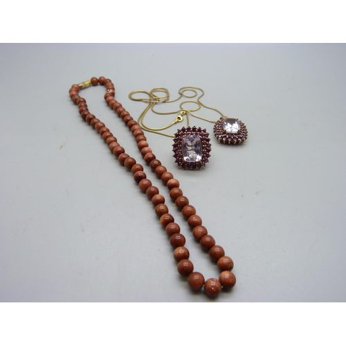 1090 - A gold stone bead necklace, a silver pendant on a silver chain and a silver ring, O