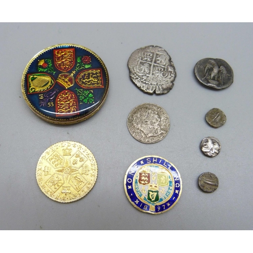 1100 - An enamelled Victorian coin, a gilt George III coin, a decorated crown and six other coins