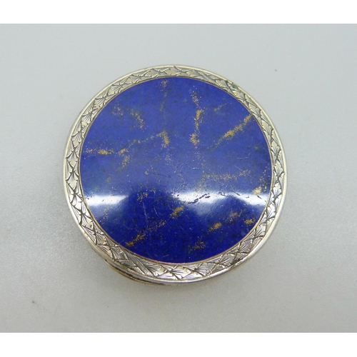 1102 - An 800 silver and lapis lazuli powder box with mirror inside the lid, 53mm diameter, lapis scratched