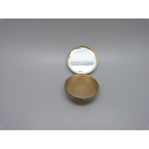 1102 - An 800 silver and lapis lazuli powder box with mirror inside the lid, 53mm diameter, lapis scratched