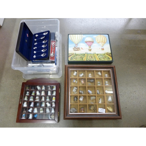 1116 - Two cases of collectors thimbles, souvenir spoons, place mats**PLEASE NOTE THIS LOT IS NOT ELIGIBLE ... 