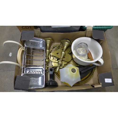 1142 - Metal ware including a pair a brass candlesticks, two irons, a glass shade, etc.**PLEASE NOTE THIS L... 