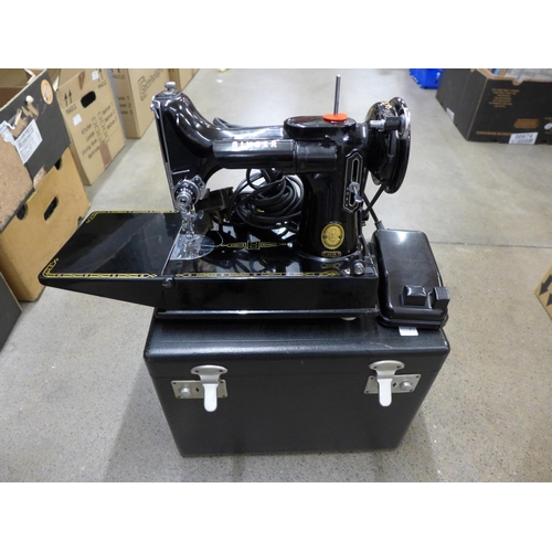 1145 - A cased Singer 221K sewing machine with instructions and accessories**PLEASE NOTE THIS LOT IS NOT EL... 