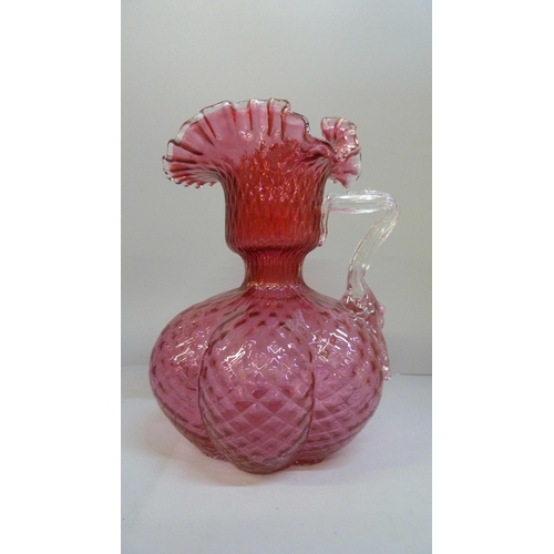 608 - A large cranberry glass jug, 25cm