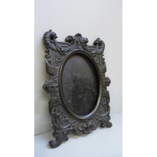 615 - A French Gothic photograph frame, possibly Gutta Percha, 17cm x 22cm