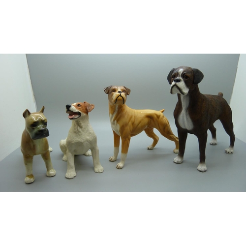 638 - A Royal Doulton Boxer dog and three other dog figures