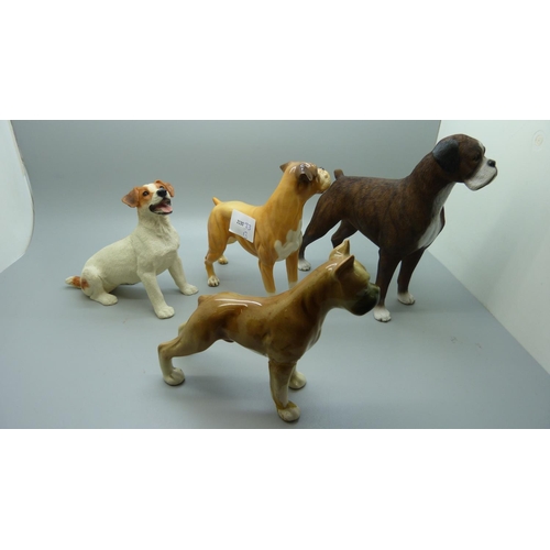 638 - A Royal Doulton Boxer dog and three other dog figures