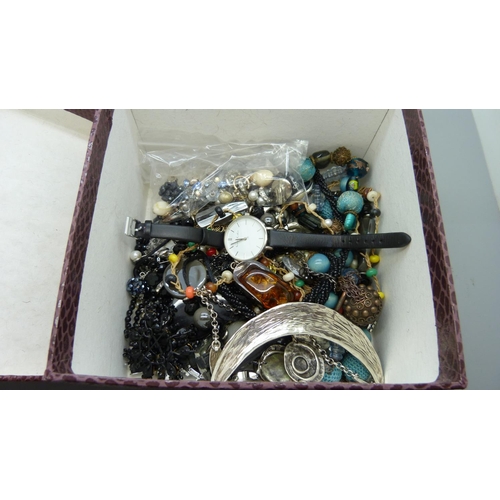 640 - A box of costume jewellery and wristwatches including an amber pendant and chain