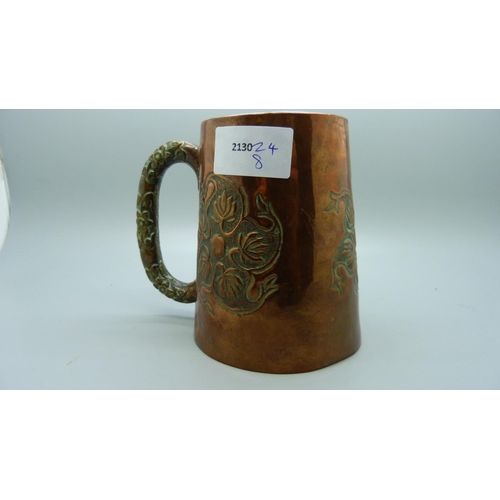 643 - An embossed copper mug