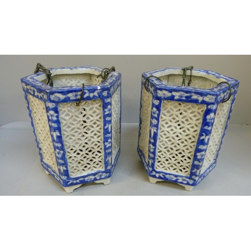 659 - A pair of Chinese porcelain pierced hanging lanterns, 18cm