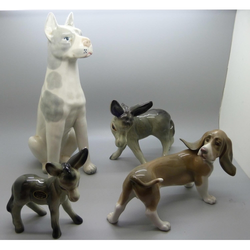 661 - A Lladro figure of a Bassett Hound, a figure of a dog and two Coopercraft donkeys