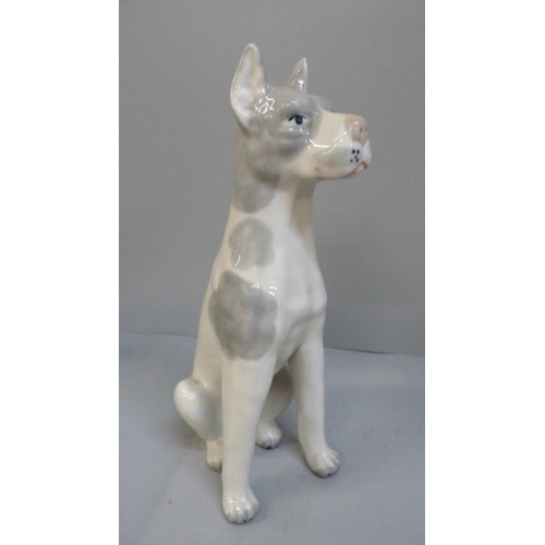 661 - A Lladro figure of a Bassett Hound, a figure of a dog and two Coopercraft donkeys