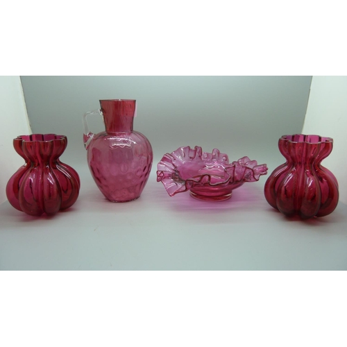 675 - A pair of cranberry glass vases, bowl and one other vase