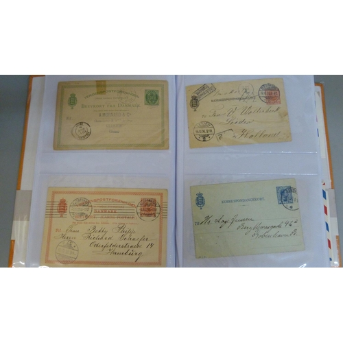 694 - Stamps; Worldwide postal stationery in album (135 items)