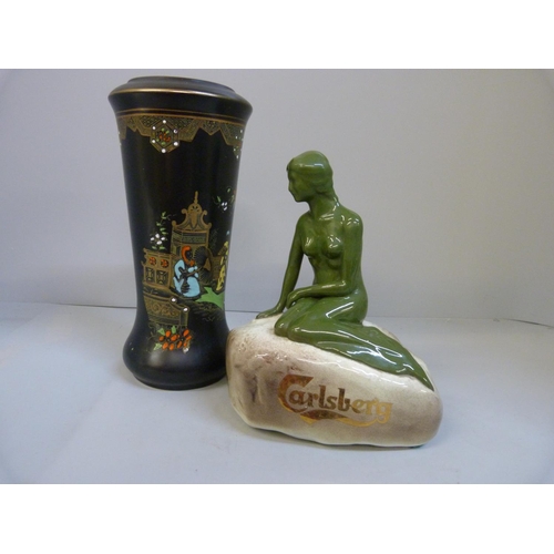 711 - A Carlsberg advertising figure and a Blairs vase