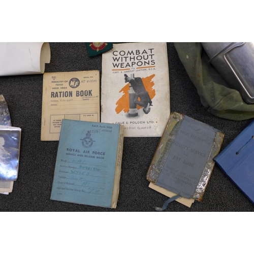 748 - A box of military items; helmet, flask, bugle, paperwork, etc.