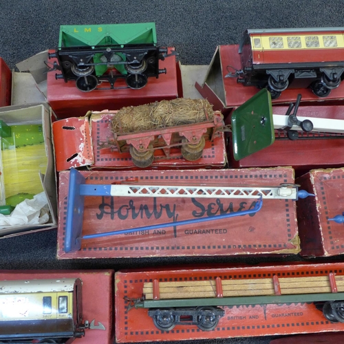 753 - An assortment of boxed Hornby 0 gauge rolling stock, signals, etc.