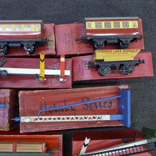 753 - An assortment of boxed Hornby 0 gauge rolling stock, signals, etc.