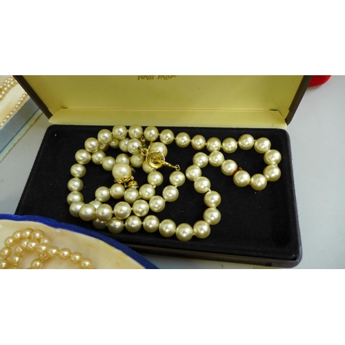 761 - A quantity of faux pearls including Lotus