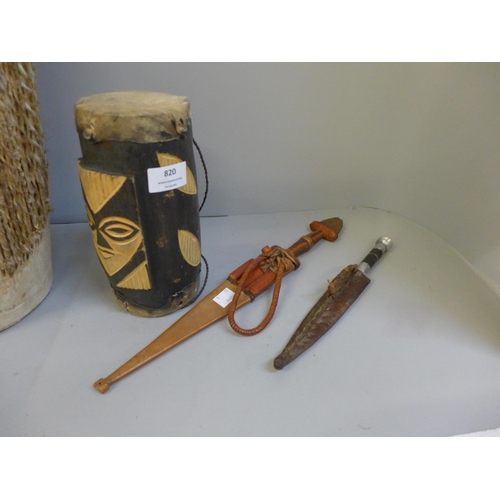 820 - Two African animal hide drums and two knives