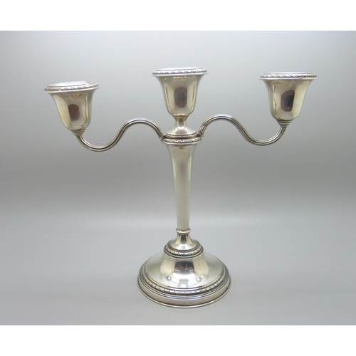 839 - A silver single candlestick or three branch candelabra, by Adie Brothers, 21cm