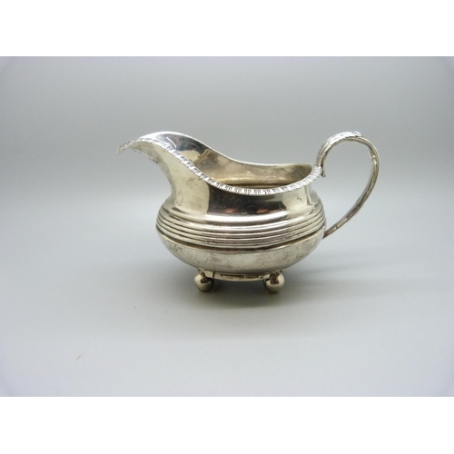 847 - A Georgian silver jug, worn London mark, 144g