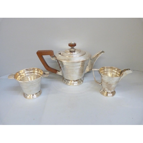 848 - A Walker & Hall Art Deco three piece silver tea service, Sheffield 1944, 1074g