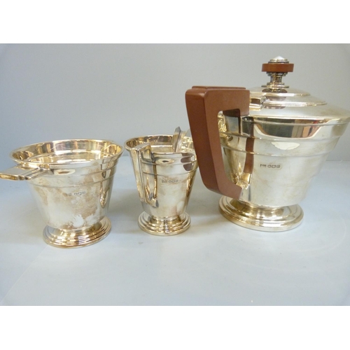 848 - A Walker & Hall Art Deco three piece silver tea service, Sheffield 1944, 1074g