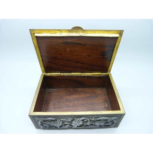 851 - An Indian white metal on brass box with wood liner, with detailed musician on the lid and birds and ... 