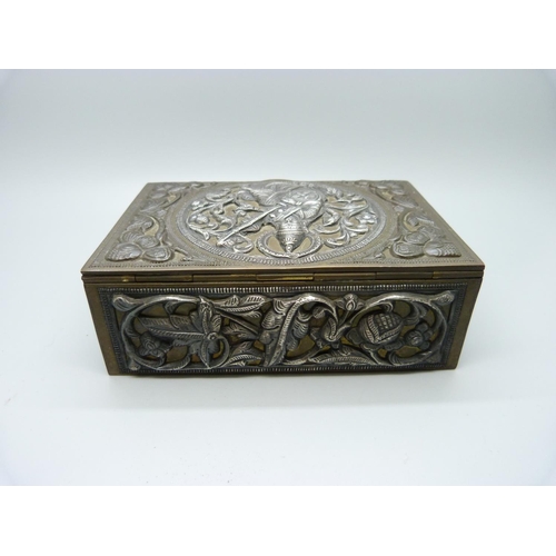 851 - An Indian white metal on brass box with wood liner, with detailed musician on the lid and birds and ... 