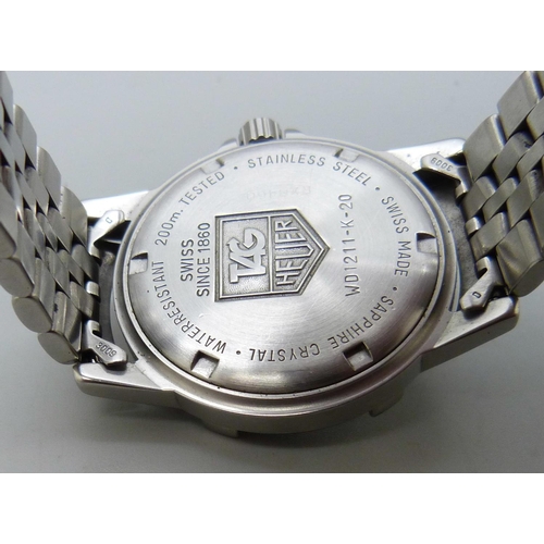 865 - A stainless steel Tag Heuer professional wristwatch, with box