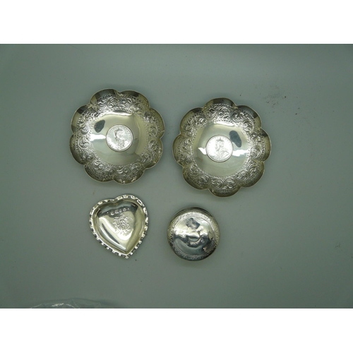 882 - A pair of silver coin set dishes, a Victorian silver heart shaped dish and a circular silver pot wit... 