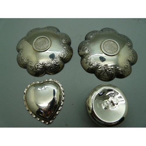 882 - A pair of silver coin set dishes, a Victorian silver heart shaped dish and a circular silver pot wit... 