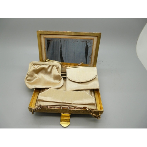 884 - A Japanese purse with silk compartments and metal mount