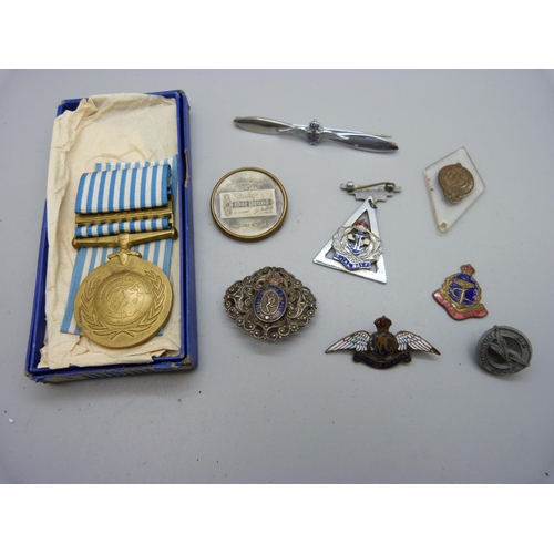 916 - An enamelled Royal Flying Corps RFC badge, enamel a/f, a RAF propeller brooch, a Korea medal, etc.