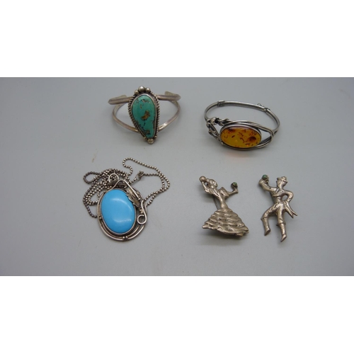 955 - Two silver brooches, a silver and turquoise pendant and chain and two bangles