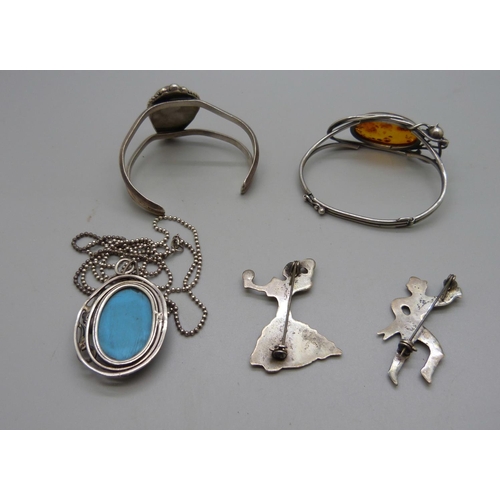 955 - Two silver brooches, a silver and turquoise pendant and chain and two bangles