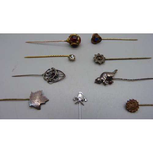 956 - Hat pins including silver, one lacking cabochon garnet