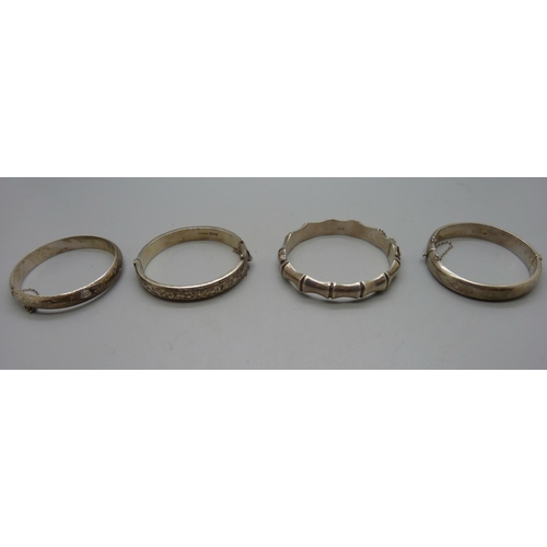 958 - Four silver bangles, 64g