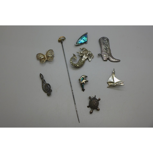 963 - Silver brooches including a Mermaid and a novelty cowboy boot