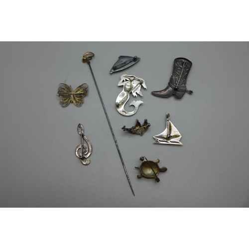 963 - Silver brooches including a Mermaid and a novelty cowboy boot